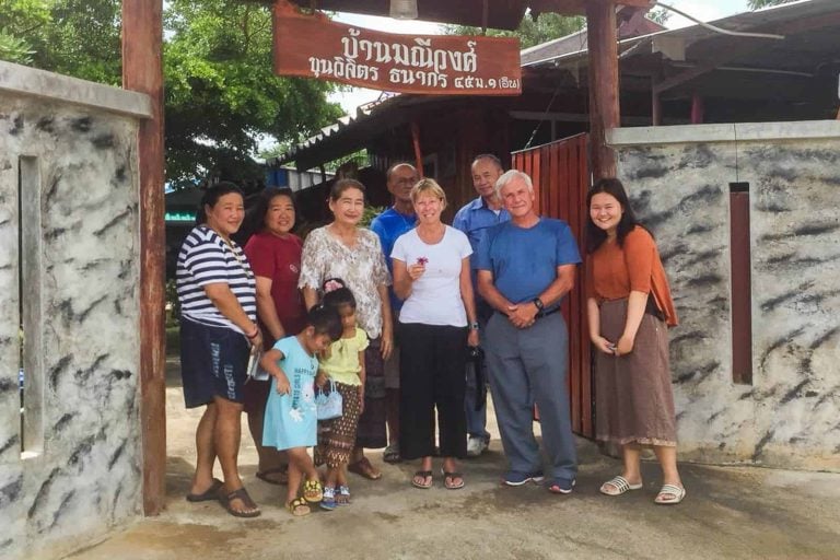 Tourist Take Photo With A Local Family Ban Maneewong
