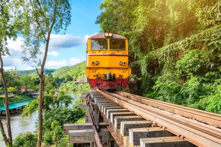 Ancient Train Running On Wooden Railway In Tham Krasae