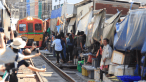 Maeklong Railway Market. Visit the most unusual market in Thailand. cover