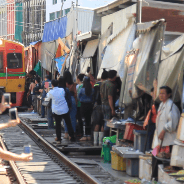Maeklong Railway Market. Visit the most unusual market in Thailand. cover