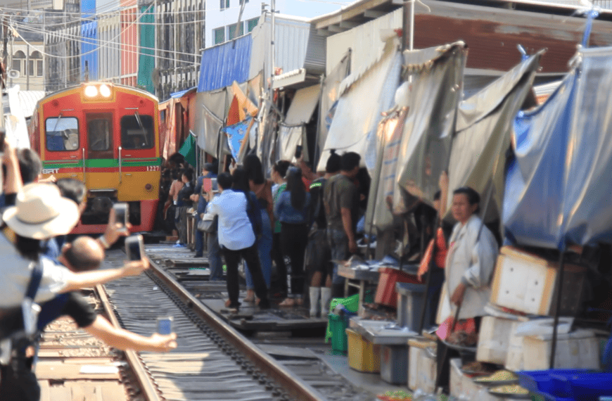 Maeklong Railway Market. Visit the most unusual market in Thailand. cover